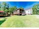 Expansive backyard with deck and covered porch, ideal for outdoor activities and entertaining at 3564 Lower Moncure Rd, Sanford, NC 27330