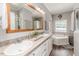 Well-lit bathroom featuring a soaking tub, double vanity, and tile floors at 3564 Lower Moncure Rd, Sanford, NC 27330