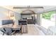 Cozy bedroom with a work desk, storage loft, and natural light, creating a comfortable and functional space at 3564 Lower Moncure Rd, Sanford, NC 27330