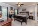 Primary bedroom with a king bed and sitting area at 3564 Lower Moncure Rd, Sanford, NC 27330