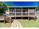 View of the wooden deck with stairs leading to the yard at 3564 Lower Moncure Rd, Sanford, NC 27330