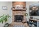Living room fireplace with brick surround and hearth at 3564 Lower Moncure Rd, Sanford, NC 27330