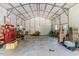 Spacious garage interior with ample storage, tools, and equipment, ideal for a workshop or hobby space at 3564 Lower Moncure Rd, Sanford, NC 27330
