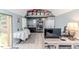 Stylish living area with a table, gray plank flooring, and modern decor, creating a cozy and inviting space at 3564 Lower Moncure Rd, Sanford, NC 27330