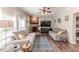 Cozy living room featuring a stone fireplace and comfortable seating at 3564 Lower Moncure Rd, Sanford, NC 27330