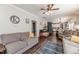 Open concept living room flows into kitchen and dining room at 3564 Lower Moncure Rd, Sanford, NC 27330