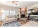 Living room featuring a stone fireplace and comfortable seating at 3564 Lower Moncure Rd, Sanford, NC 27330