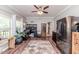Versatile space with home office setup and stainless steel refrigerator at 3564 Lower Moncure Rd, Sanford, NC 27330