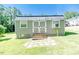 Charming outdoor shed with double doors and windows, perfect for storage or a small workshop at 3564 Lower Moncure Rd, Sanford, NC 27330