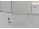 Bright bathroom features a soaking tub with subway tile surround and glass enclosed shower at 400 Nottinghill Walk, Apex, NC 27502