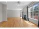 Bright living room with a fireplace, large windows, and hardwood floors that provide an ideal space for relaxation at 400 Nottinghill Walk, Apex, NC 27502