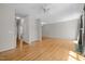 Spacious living room with gleaming hardwood floors, neutral walls, and recessed lighting for a modern and inviting space at 400 Nottinghill Walk, Apex, NC 27502