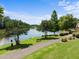 Scenic walking path alongside a tranquil lake offers residents natural beauty and recreational opportunities at 400 Nottinghill Walk, Apex, NC 27502