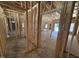 Spacious, unfinished interior with exposed wooden framing and visible room divisions at 4026 N Nc 581 Hwy, Kenly, NC 27542