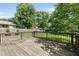 Spacious backyard deck perfect for outdoor entertaining, surrounded by lush greenery and mature trees at 405 E Millbrook Rd, Raleigh, NC 27609