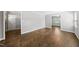 Inviting bedroom with gleaming hardwood floors, neutral walls, and ample natural light at 405 E Millbrook Rd, Raleigh, NC 27609