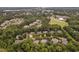 Aerial view showcasing a neighborhood with mature trees, manicured lawns, and diverse architectural styles at 409 Englewood Dr, Chapel Hill, NC 27514
