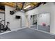 Functional basement space with workout equipment, a mounted TV, and a mirrored wall at 409 Englewood Dr, Chapel Hill, NC 27514