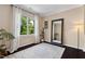 Bright bedroom with hardwood floors, natural light, and neutral walls ready for personalization at 409 Englewood Dr, Chapel Hill, NC 27514