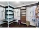 Modern walk-in closet with custom shelving, drawers, and hanging space is ready for your wardrobe at 409 Englewood Dr, Chapel Hill, NC 27514
