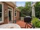 Relax on this private deck with grill, seating area, and covered umbrella at 409 Englewood Dr, Chapel Hill, NC 27514