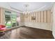 Elegant dining room with hardwood floors, chandelier, large window, and traditional wallpaper, great for formal gatherings at 409 Englewood Dr, Chapel Hill, NC 27514