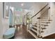 Spacious two-story foyer with staircase, arched doorway, and hardwood floors, offering an inviting entrance at 409 Englewood Dr, Chapel Hill, NC 27514