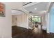 Open-concept foyer with hardwood floors, staircase, and elegant archways leading to adjoining living spaces at 409 Englewood Dr, Chapel Hill, NC 27514