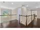 Spacious hallway with hardwood floors, large arched window, and a chandelier at 409 Englewood Dr, Chapel Hill, NC 27514