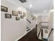 Upstairs hallway with hardwood floors and picture frame molding that leads to the staircases at 409 Englewood Dr, Chapel Hill, NC 27514