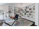 Bright home office featuring a glass desk, an area rug, and extensive custom shelving at 409 Englewood Dr, Chapel Hill, NC 27514