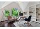 Stylish home office with large windows, a glass desk, and custom built-in shelving at 409 Englewood Dr, Chapel Hill, NC 27514