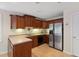 Well-appointed kitchen with stainless steel appliances, wooden cabinets, and sleek countertops at 409 Englewood Dr, Chapel Hill, NC 27514
