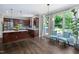 Well-lit kitchen with stainless steel appliances, a kitchen island, and a cozy breakfast nook at 409 Englewood Dr, Chapel Hill, NC 27514