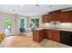 Inviting kitchen with wooden cabinets, bright natural light, and a breakfast nook at 409 Englewood Dr, Chapel Hill, NC 27514