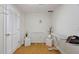 Bright laundry room with a door to the side, an ironing board, and decorations for a well kept space at 409 Englewood Dr, Chapel Hill, NC 27514