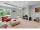 Bright living room featuring modern lighting, a window with a view, and casual beanbag style chairs at 409 Englewood Dr, Chapel Hill, NC 27514