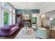 Sophisticated living room with a striking fireplace, stylish seating, and large windows at 409 Englewood Dr, Chapel Hill, NC 27514
