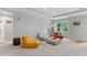 Bright living room featuring modern lighting, a window with a view, and casual beanbag style chairs at 409 Englewood Dr, Chapel Hill, NC 27514