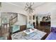 Open living room with modern lighting, comfortable seating, and seamless flow into the adjacent kitchen, perfect for entertaining at 409 Englewood Dr, Chapel Hill, NC 27514
