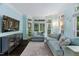 Bright and airy living room with large windows, a comfortable sofa, and stylish decor, creating a relaxing atmosphere at 409 Englewood Dr, Chapel Hill, NC 27514