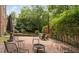 Brick patio featuring outdoor seating and a fire pit for entertaining at 409 Englewood Dr, Chapel Hill, NC 27514