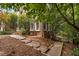 Landscaped side yard with brick pathway and well-maintained greenery at 409 Englewood Dr, Chapel Hill, NC 27514