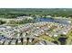 Aerial view of the neighborhood with a view of the lake and surrounding trees at 4102 Catfish Way, Durham, NC 27703