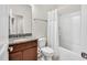 A clean bathroom with granite counters and a shower-tub combo at 4102 Catfish Way, Durham, NC 27703