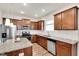 Bright kitchen with stainless appliances, granite countertops, ample cabinetry, and a functional island at 4102 Catfish Way, Durham, NC 27703