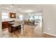 Open concept kitchen with a large island, stainless appliances, wood floors and an adjoining living area at 4102 Catfish Way, Durham, NC 27703
