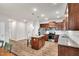 Modern kitchen with stainless appliances, a center island, granite counters, and wood flooring at 4102 Catfish Way, Durham, NC 27703
