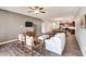 A living room features a TV, ceiling fan, sofa, and wooden floors at 4102 Catfish Way, Durham, NC 27703