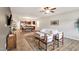 A living room featuring a TV, ceiling fan, sofa, and wooden floors at 4102 Catfish Way, Durham, NC 27703